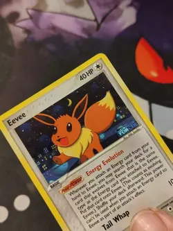 **Damaged Eevee Reverse Holo Stamped Pokemon Card 55/115 - Unseen Forces - Image 1