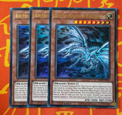 YUGIOH BLUE-EYES ALTERNATIVE WHITE DRAGON ULTRA RARE EXC RA02-EN010 x3 PLAYSET - Image 1
