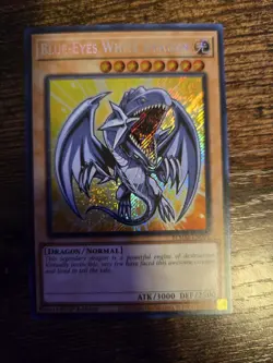 Yu-Gi-Oh Blue-Eyes White Dragon BLMM-EN001 Secret Rare Chibi Art 1st Edition - Image 1