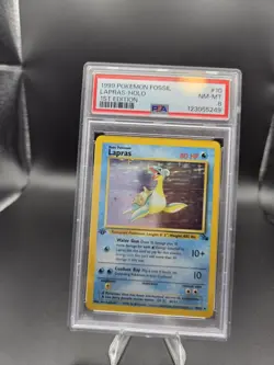 1999 POKEMON FOSSIL 1ST EDITION #10 LAPRAS-HOLO PSA 8 - Image 1