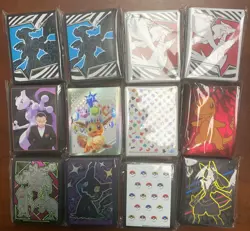 Lot of 12 Assorted Pokemon Sealed ETB Card Sleeves With Tin - Image 1