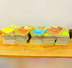 1000+ Pokemon Mixed Cards Including 2 Pokemon Tin Boxes - Image 1