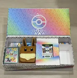 Pokemon TCG Prismatic Evolutions SPC Playmat, Deck Box, and Sleeves - Image 1