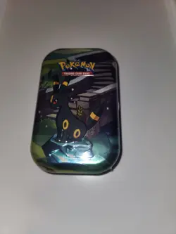 Pokemon TCG Scarlet and Violet Prismatic Evolutions Mini Tin Umbreon - Image 1