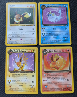 Team Rocket Eeveelutions set Eevee Flareon Jolteon Vaporeon Pokemon TCG NM/M - Image 1