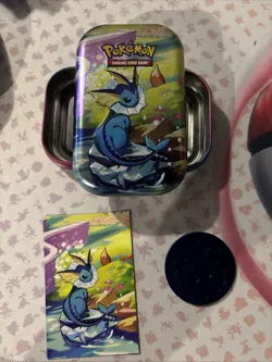 Vaporeon Prismatic Evolutions Mini Tin - Empty Tin + Art Card & Coin - Image 1