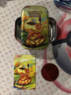 Flareon Prismatic Evolutions Mini Tin - Empty Tin + Art Card & Coin - Image 1