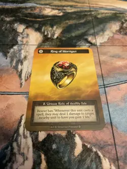 Sorcery Contested Realm Arthurian Legends - Ring of Morrigan - Nonfoil Unique - Image 1