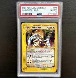 KABUTOPS 150/144 | PSA 8 | Crystal Skyridge WOTC Holo Graded Pokemon Card - Image 1