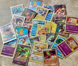 Lot of 26 Pokemon Cards in Individual Protective Card Sleeves - Image 1