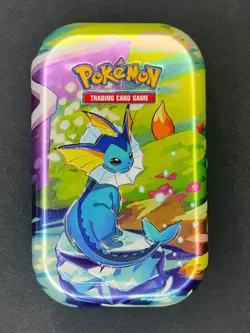 Vaporeon Prismatic Evolutions Mini Tin - Opened (NO PACKS) w/ Art Card + Coin - Image 1