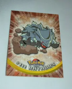 1999 TOPPS POKEMON TV ANIMATION BASE CARD - # 111 RHYHORN WITH BLUE LOGO - Image 1
