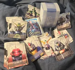 Gundam Card Game Official Deck Case 01 With Aile Strike Promo Sleeves and More - Image 1