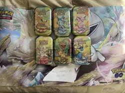 Pokemon TCG Prismatic Evolutions Mini Tin - Factory Sealed (Random Tin) - Image 1