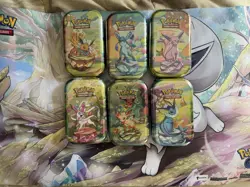 Pokemon TCG Prismatic Evolutions Mini Tin - Factory Sealed (Random Tin) - Image 2