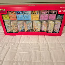 Pokemon Prismatic Evolutions Mini Tin 8-Pack With Promo Cards Costco - Image 1
