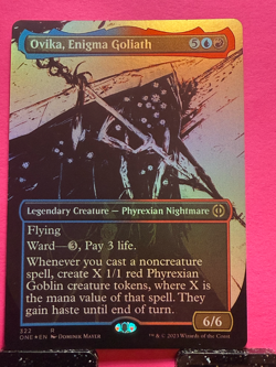 Ovika, Enigma Goliath (Showcase) (Step-and-Compleat Foil) Phyrexia - Image 1
