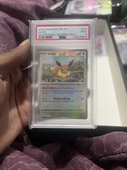 Pokemon Eevee Prismatic Evolutions Master Ball Reverse Holo #074 PSA 9 MINT - Image 1