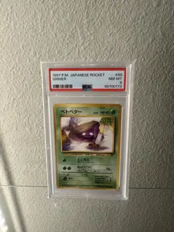 PSA 8 NM - MT 1997 Pokemon Japanese Team Rocket Grimer No. 088 BANNED ART CARD - Image 1