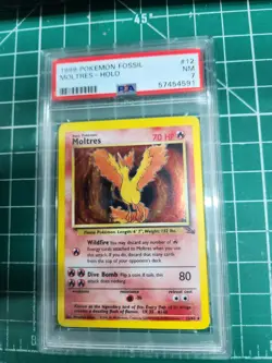 1999 Pokemon Fossil Moltres Holo #12 PSA 7 - Image 1