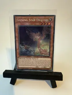 YuGiOh! BLTR-EN002, Shining Star Dragon, Secret Rare Card, 1st Edition - Image 1