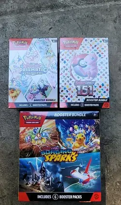 Pokemon TCG: Prismatic Evolutions, 151, and Surging Sparks Booster Bundles - Image 1