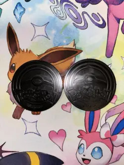 Pokemon Pikachu & Alcremie Coins And Stickers from 2025 Holiday Advent Calendar - Image 2