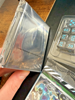 Pokemon Black Bolt ETB Thundurus prom, dice, 65 card sleeves, coins & 45 energys - Image 3
