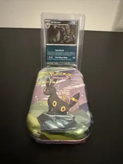 Pokemon Costco Prismatic Evolutions TCG Mini Tin Sealed + Umbreon Foil Card - Image 1