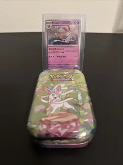 Pokemon Costco Prismatic Evolutions TCG Mini Tin Sealed + Sylveon Foil Card - Image 1