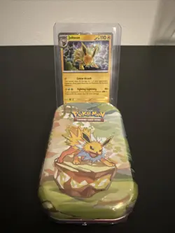 Pokemon Costco Prismatic Evolutions TCG Mini Tin Sealed + Jolteon Foil Card - Image 1