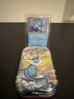 Pokemon Costco Prismatic Evolutions TCG Mini Tin Sealed + Vaporeon Foil Card - Image 1