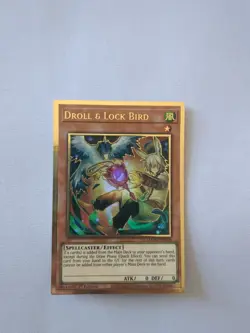 MAGO-EN006 Droll & Lock Bird Premium Gold 1st Edition Yugioh Card - Image 1