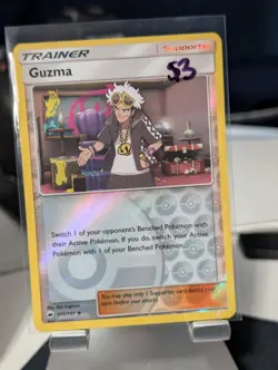 Pokemon Cards - Sun & Moon Burning Shadows 115/147 - GUZMA (REVERSE holo-foil) - Image 1