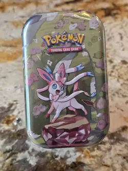 Pokemon TCG: Scarlet & Violet Prismatic Evolutions Mini Tin - Sylveon - Image 1