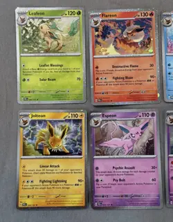 Pokemon Prismatic Evolutions Costco Mini Tin Cosmo Promos 8 Umbreon Sylveon - Image 2