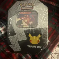 Pokemon TCG 25th Anniversary Celebrations Tin Lance’s Charizard V Sealed - Image 1