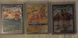 Pokemon 2021 Reshiram & Charizard GX SM247 Holo Card. Plus two other Charizards. - Image 1