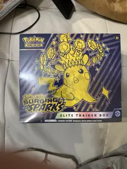 Pokemon Center Prismatic Evolutions and Surging Sparks ETB Sealed - Image 2