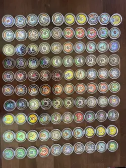 Pokemon Lot - 104 Coins with protective sleeves - Image 1