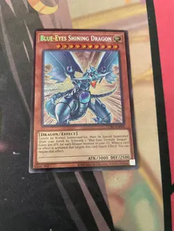 YUGIOH - BLUE EYES SHINING DRAGON - SECRET RARE - LCKC - UNLIMITED - NM - Image 1