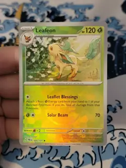 LEAFEON 005/131 PRISMATIC EVOLUTIONS POKEMON (POKE BALL HOLO, NM) - Image 1