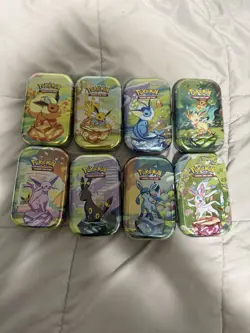 8 Pokemon Prismatic Evolutions Empty Mini Tins With Coins And Pictures. Eevees! - Image 1