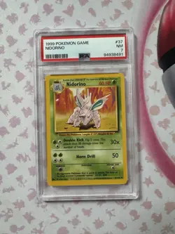 1999 POKEMON NIDORINO PSA 7 NM 37/102 BASE SET UNLIMITED - Image 1