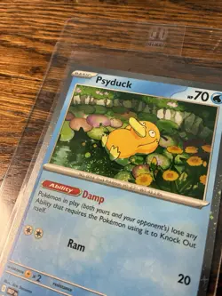 Psyduck 007 Cosmos Holo Mega Evolution Black Star Promo Pokemon Card (SWIRL) - Image 1