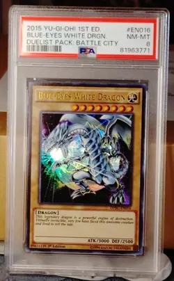 2015 Yu-Gi-Oh 1st Edition Blue-Eyes White Dragon DPBC-EN016 Ultra Rare PSA 8 - Image 1