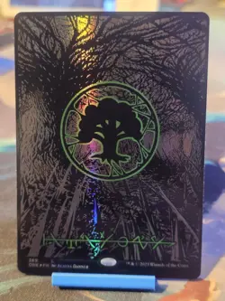 Forest (Phyrexian) - Full Art (Oil Slick Raised Foil) Phyrexia: All Will Be One - Image 1