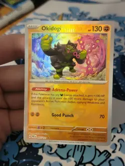 Okidogi Poke Ball Pattern 057/131 Prismatic Evolutions Holo Pokemon Card TCG NM - Image 1