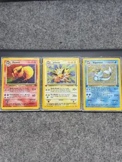 Eeveelution set: Vaporeon (1st ed), Jolteon (1st ed), and Flareon Pokemon Cards - Image 1