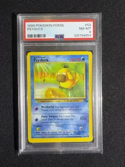 1999 POKEMON FOSSIL 1999-2000 COPYRIGHT #53 PSYDUCK PSA 8 - Image 1